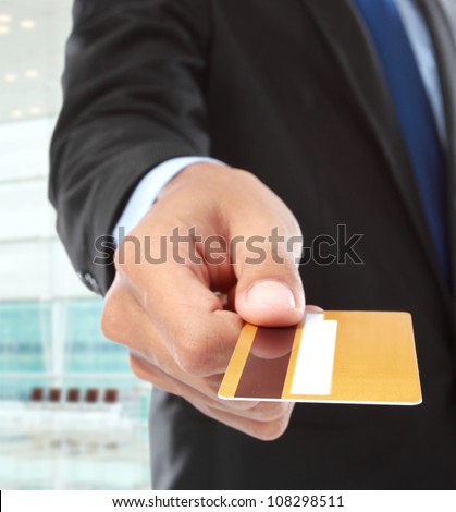 cropped image of hands paying using credit card