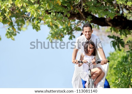 father and daughter riding bikes together