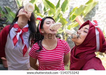 portrait of indonesia crackers eating competition on independence day celebration