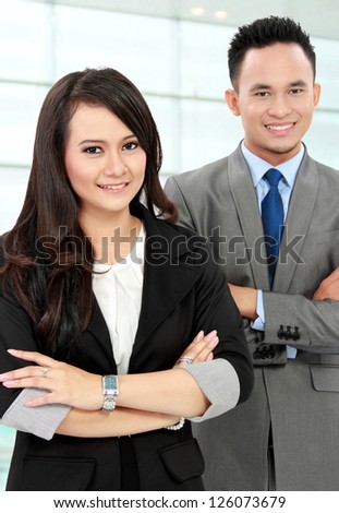 Portrait of a woman and man office workers smiling isolated on white background