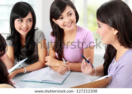 group of young woman studying together with friends