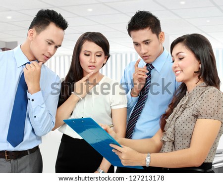 group of happy business people doing presentation