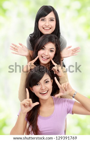 Happy group of girls in good pose smiling isolated on white background