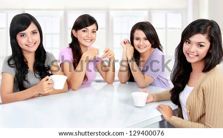 group of women friends having quality time together at home