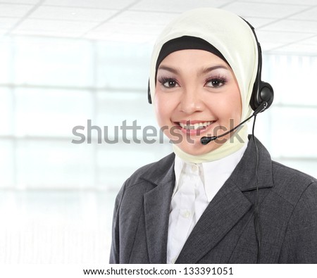 close up portrait of Young beautiful Muslim woman customer service operator with headset on white background