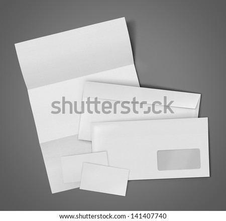 business stationary set. envelope, sheet of paper and business card on gray background