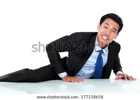 Portrait of businessman climb the wall isolated on the white background