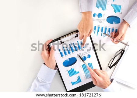 Image of business team at the meeting discussing chart