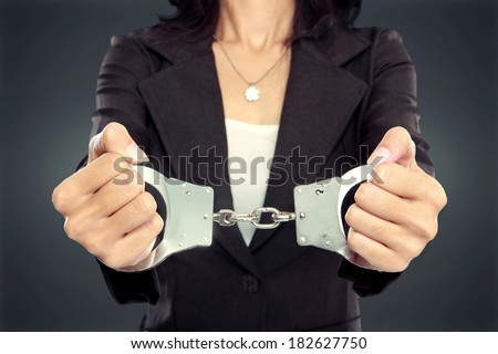 close up portrait of Young business woman in handcuffs. crime concept