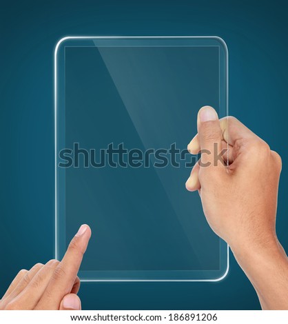 hands holding and touching on futuristic transparent tablet pc
