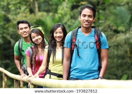 group of people hiking together. walking in the countryside