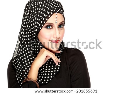 Fashion portrait of young beautiful muslim woman with black scarf isolated on white background Fashion portrait of young beautiful muslim woman with black scarf isolated on white background