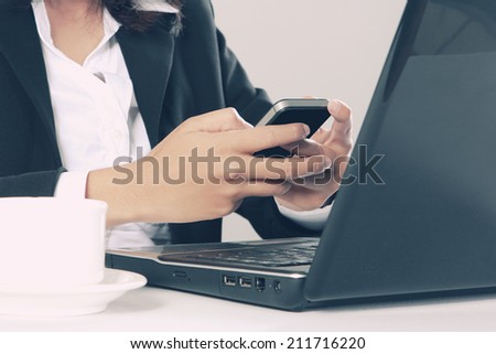 close up portrait of woman sending text message in the office