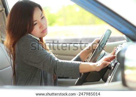 young female driver talking on the phone