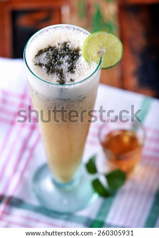 a glass of hangover saver juice with honey