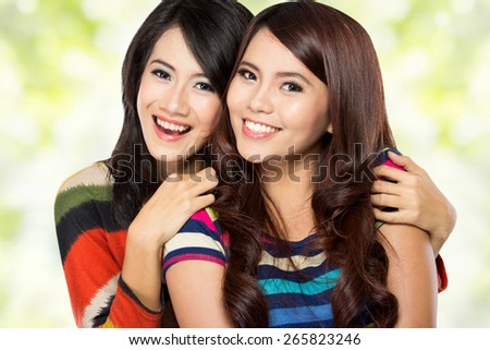 A portrait of two girls in a happy friendship, smile brightly