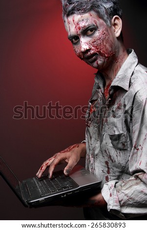 portrait of a Zombie computer maniac looking camera scarried