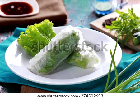 portrait of vietnamese spring roll served with soy sauce