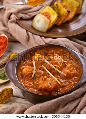 portrait of indian cuisine chicken tikka masala served with paneer tikka