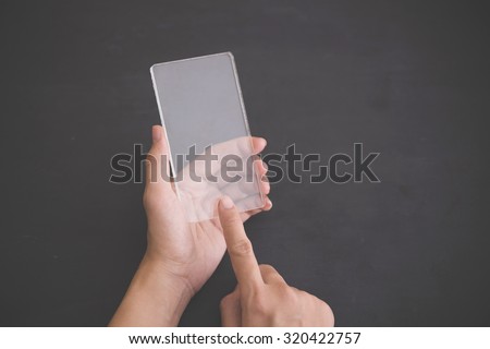 A portrait of a blank glass square on black background, futuristic transparent smart phone mock up