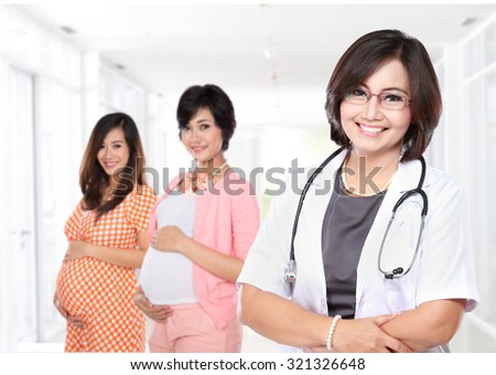 portrait of Smiling obstetricians with stethoscope with her patient