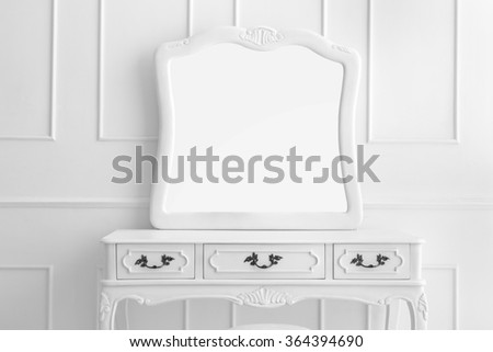portrait of vintage vanity table set with three drawers and mirror