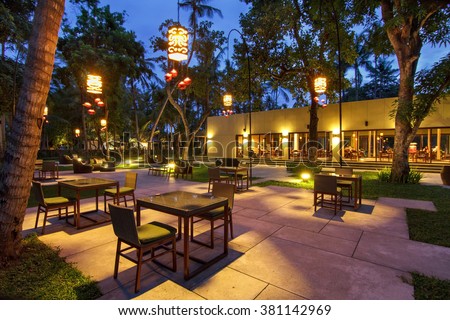 portrtait of beautiful outdoor and indoor restaurant view in night illumination