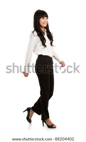 Full body portrait of walking businesswoman, full isolated on white