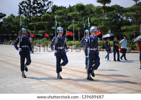 TAIPEI - OCT 1 : Guards at the Martyr\'s Shrine in Taipei, Taiwan, on their way out after being relieved of their turn guarding the shrine. OCT 1, 2012 in Taipei, Taiwan.