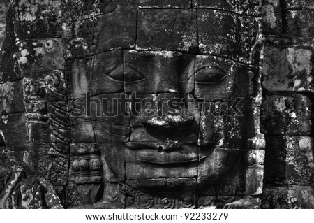 Smiling buddha face in bayon temple cambodia (black & white)