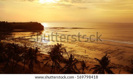 Gold sunset at low tide on Balangan beach of Bali