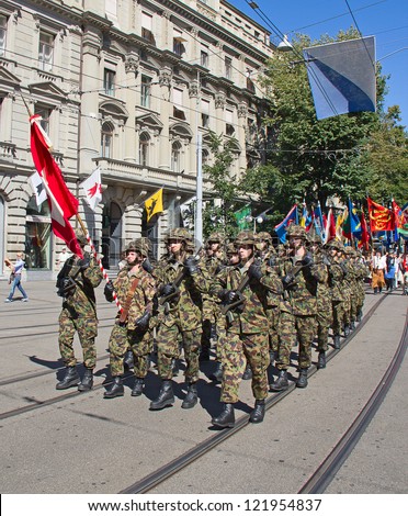 ZURICH - AUGUST 1: Infantry division of swiss army marching on the Swiss National Day parade on August 1, 2009 in Zurich, Switzerland.
