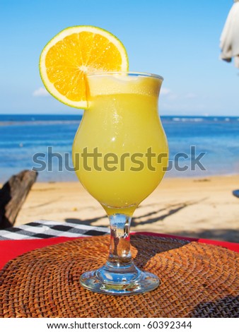 Orange cocktail on the table in the beach restaurant