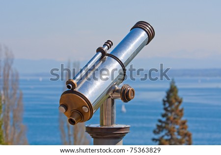 Vintage observation telescope over the sea