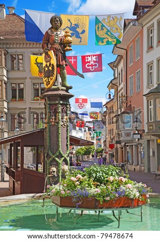 Historical center of Schaffhausen decorated with swiss cantons flags for the Swiss National day (1st August)