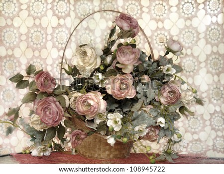for interior, still life in pastel colors, elegant, delicate bouquet of roses in a wicker basket on a lace background