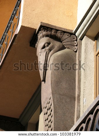 The head is a fantastic bird. Detail of decoration of the building