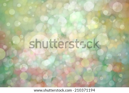 Beautiful light green bokeh background with shimmering pink gold yellow colors and white lights Festive party background. Fantasy night or magical glitter background sparkles