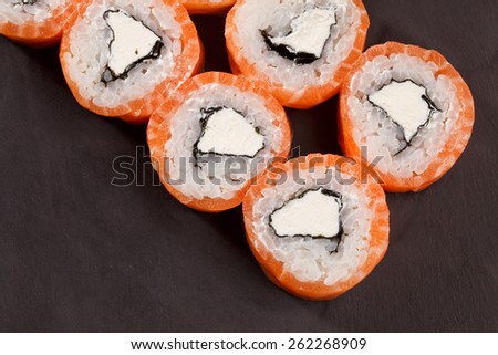 tasty Roll Philadelphia Sushi on black backround fish