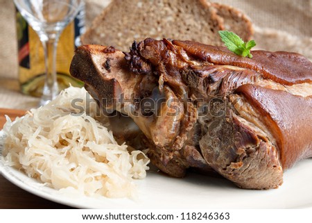 German food specialty - grilled pork knuckle with sauerkraut (manual focus)