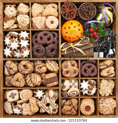 Assorted Christmas Cookies In Wooden Box With Baking Items Stock Photo