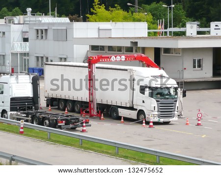 THAYNGEN - MAY 22: a cargo vehicle is going through a mobile x-ray control at the Swiss-German boarder on May 22, 2012 in Thayngen, Switzerland. Mobile x-ray scanning system is used against smuggling.