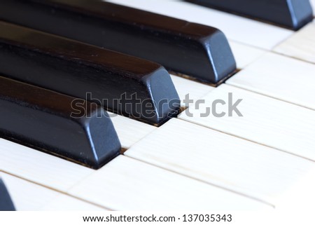Classic piano with ivory white keys and ebony black keys - macro