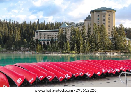 LAKE LOUISE, CANADA - JUNE, 8: Hotel Chateau Lake Louise in Alberta, Canada, with red canoes in the foreground on 08, June, 2015.