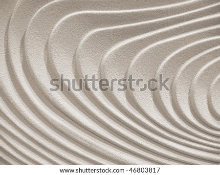 wavy curves on a sand- stone surface