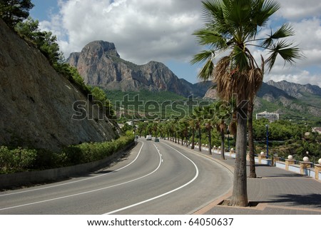 Road through mountain scenery in Spain. CV-70 from Benidorm through Guadalest. Horizontal stock photo converted from RAW. Minimal sharpening.