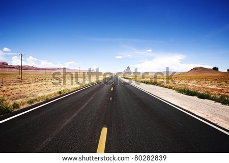 Empty straight road near Monument Valley, UT, USA