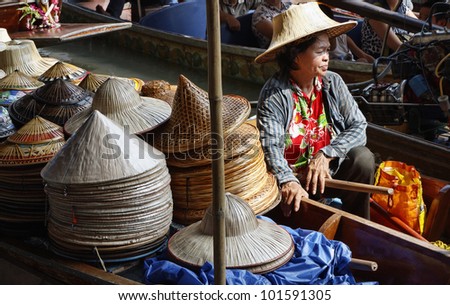 Thailand, Bangkok, Floating Market, Thai hats for sale on a boat