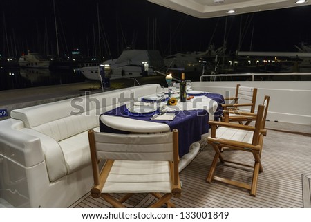 Italy, Fiumicino (Rome), RIZZARDI TEKNEMA 65 luxury yacht, stern deck and external dinner table