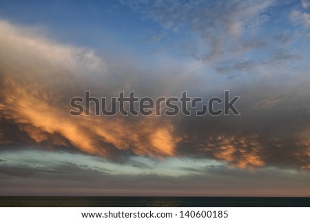Italy, Sicily Channel, clouds in the sky at sunset